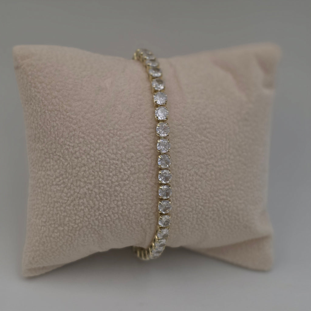 diamond tennis bracelet with yellow gold settings