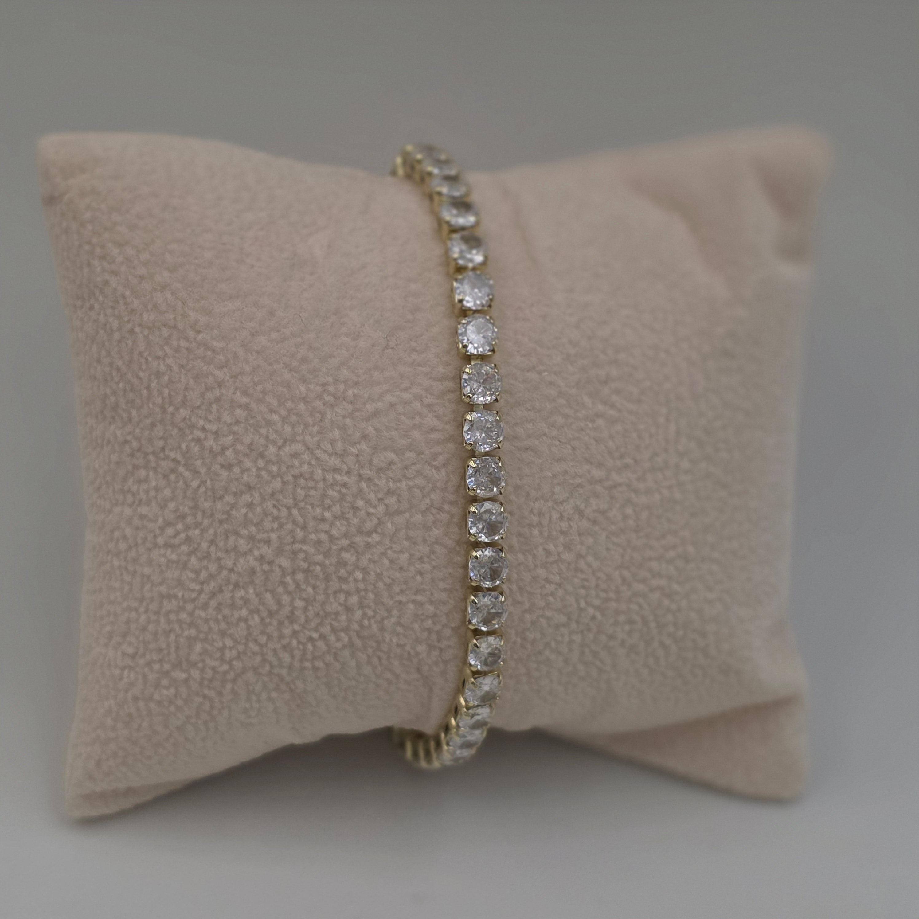 diamond tennis bracelet with yellow gold settings